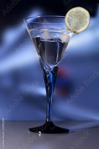 Martini Glass with green lime. Swallow dof