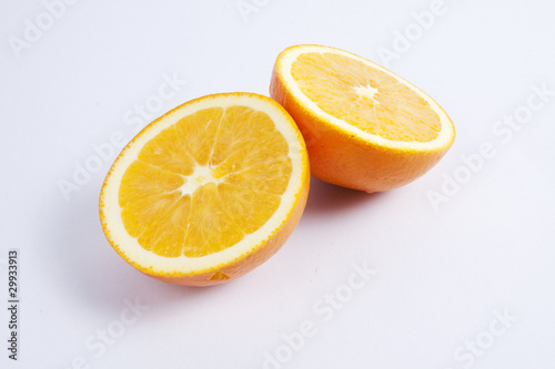 Two pieces of orange  showing texture.
