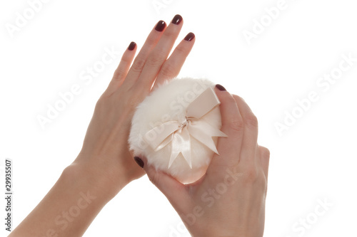 Female Hand Holding Powder Puff