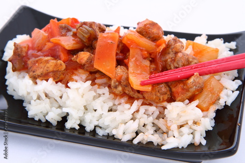 Chinese food-sweet and sour chicken with chopsticks