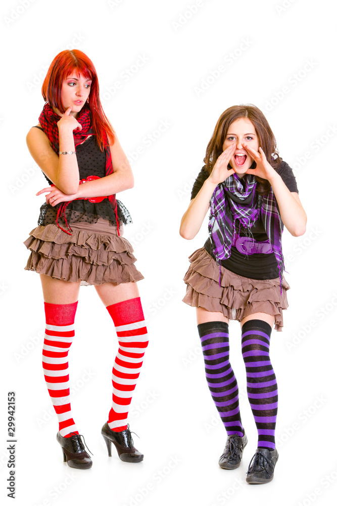 Confused girl looking at her shouting girlfriend Confused girl looking at her shouting girlfriend