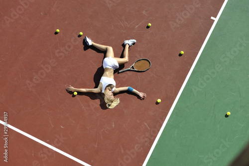 young woman play tennis outdoor © .shock