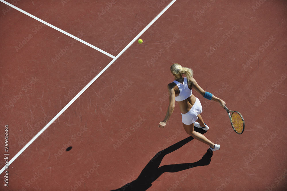 young woman play tennis outdoor