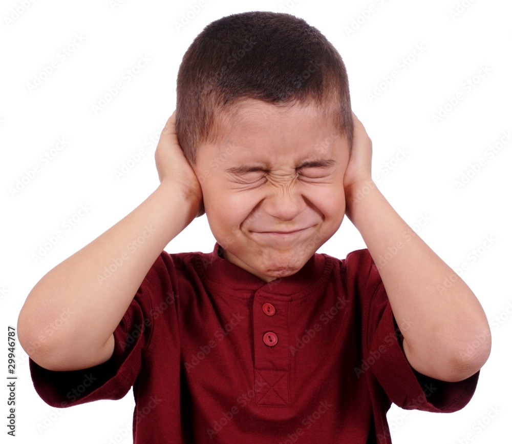 kid covering ears from loud noise, isolated Stock Photo Adobe Stock