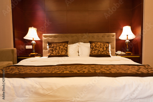 Hotel bedroom with kingsized bed and lamps