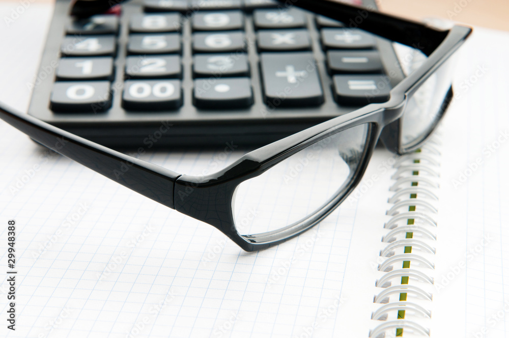 Business concept with notepad and calculator Business concept with notepad and calculator
