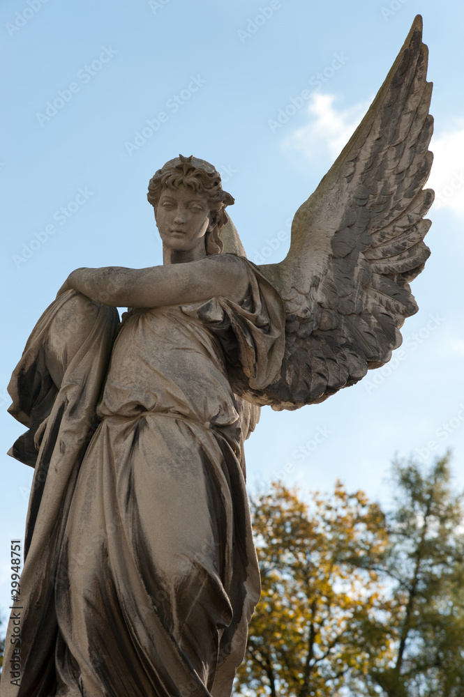 Monument to an angel on a cemetery Monument to an angel on a cemetery