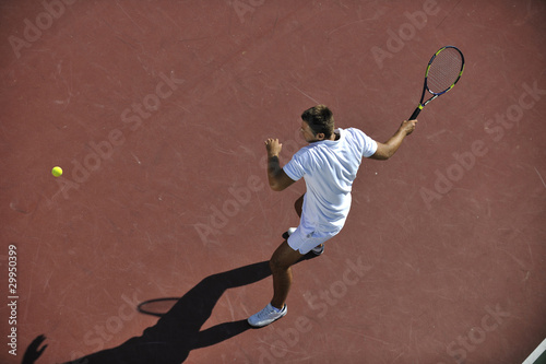 young man play tennis