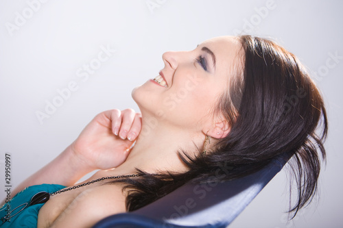 Happiness and positive. Russian girl lying in a chair and laughs