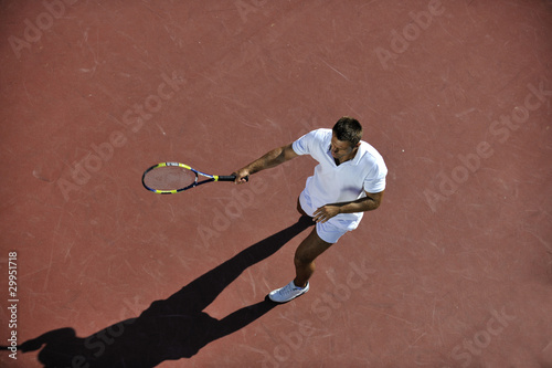 young man play tennis © .shock