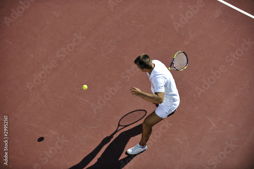 young man play tennis © .shock