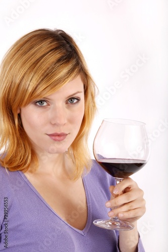 beautiful young woman enjoying wine