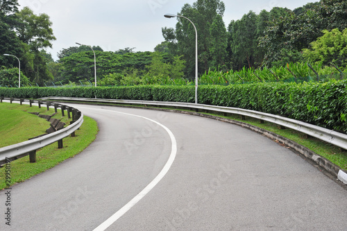 Curving Road Going Uphill With Crash Barriers