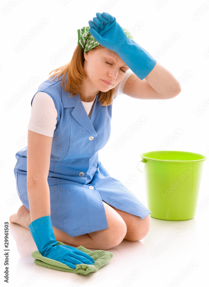 tired woman cleaning the floor with a rag tired woman cleaning the floor with a rag
