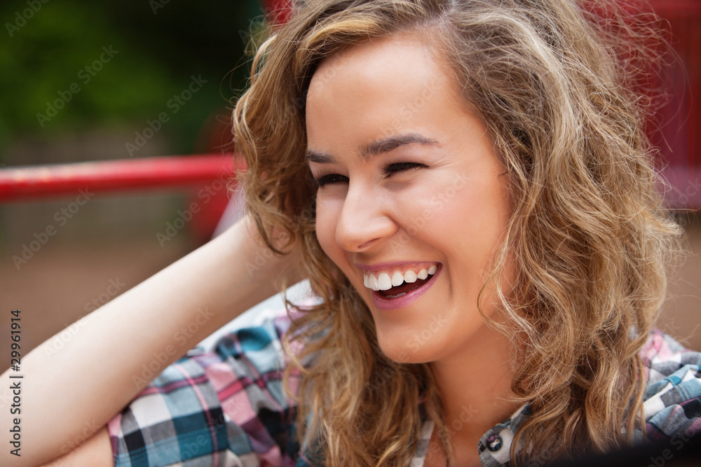 Cheerful young woman laughing