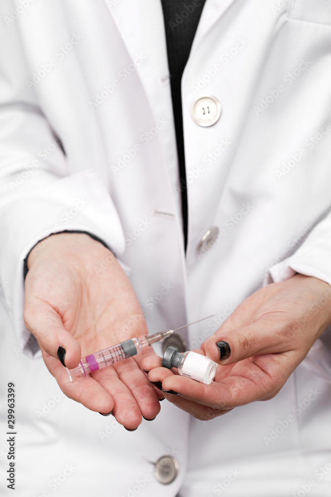 Children health - doctor hands with vaccine Children health - doctor hands with vaccine