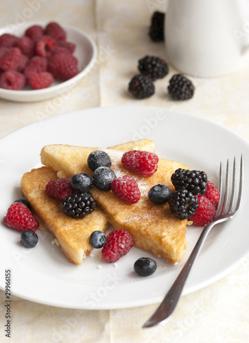 French toasts with fresh berries on a plate