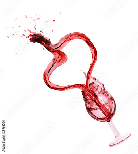 Red wine splash creating heart shape