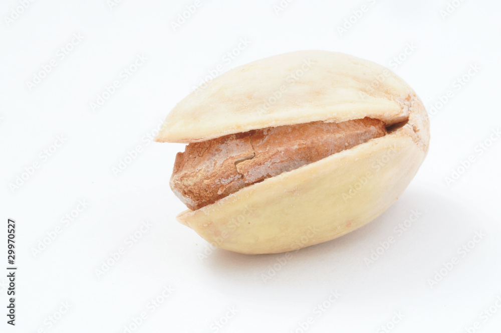 Detail shot of a pistachio nut on white background Detail shot of a pistachio nut on white background