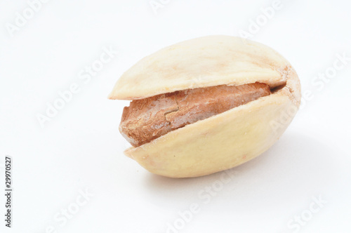 Detail shot of a pistachio nut on white background