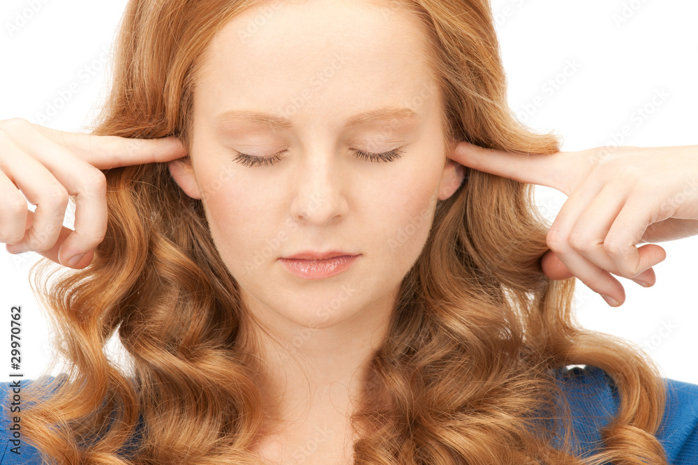 woman with fingers in ears woman with fingers in ears