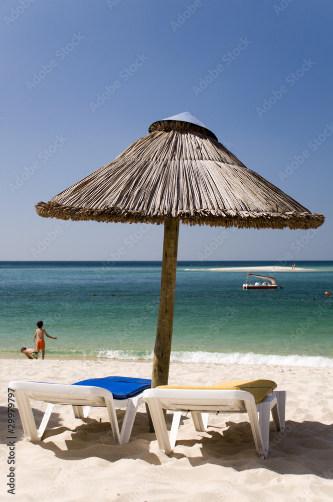 The sunshade umbrella at the beach The sunshade umbrella at the beach