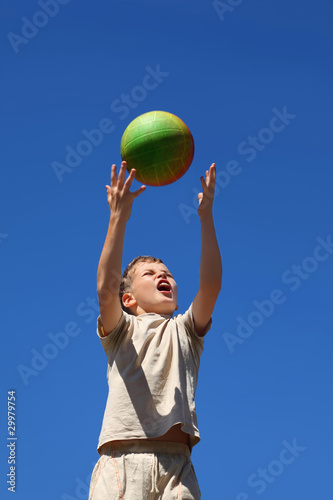Boy carrom up  ball upwards and yell © Pavel Losevsky