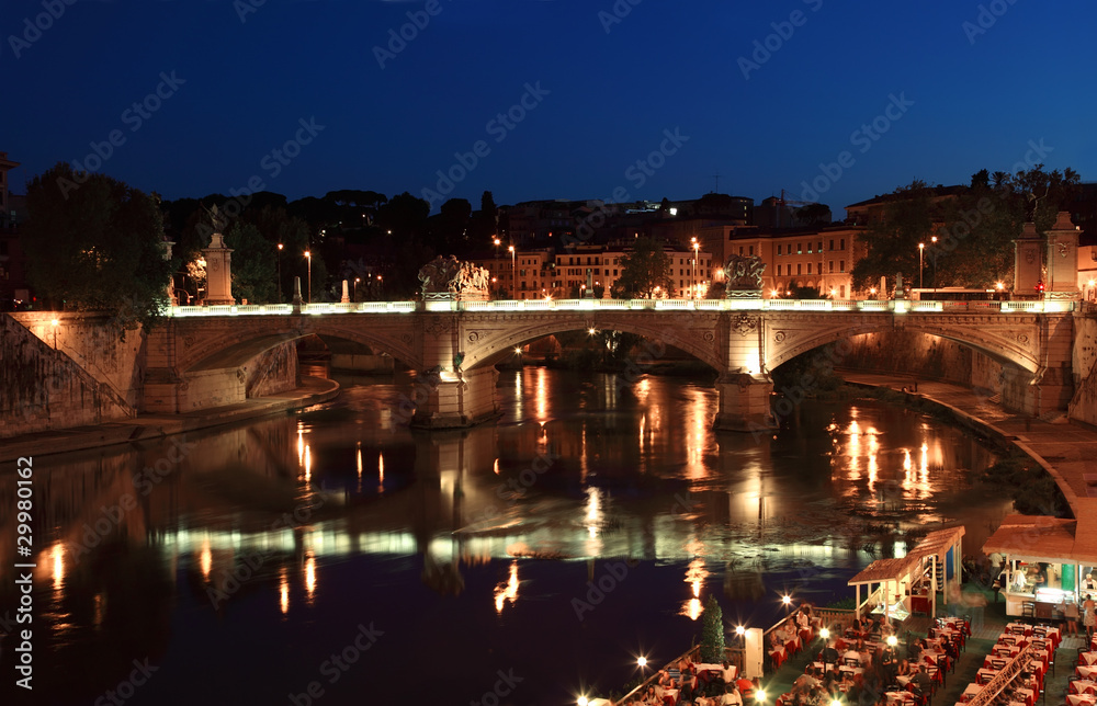 Ponte Vittorio Emanuele II at night in Rome, Italy.