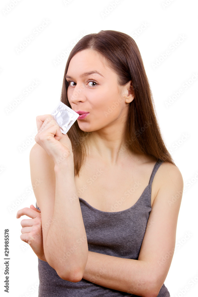 Portrait of young safety-conscious woman showing a condom Portrait of young safety-conscious woman showing a condom