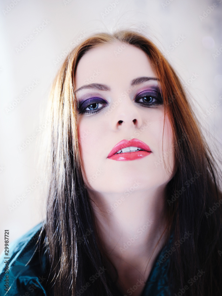 Fototapeta premium Beautiful woman face with fashion make-up in violet tones