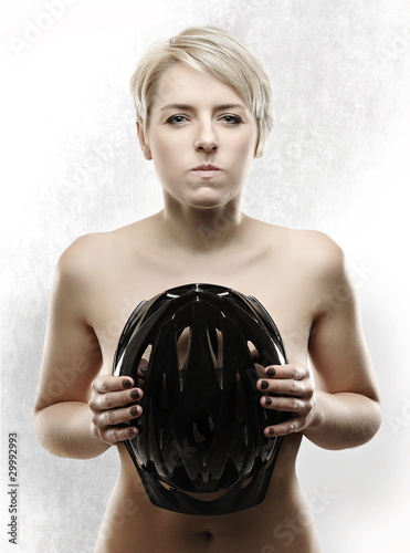 Young, beautiful woman with bicycle helmet