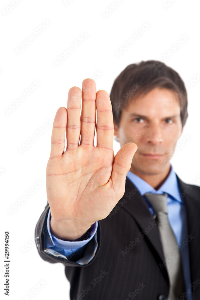 Mature businessman making stop gesture isolated on white Mature businessman making stop gesture isolated on white