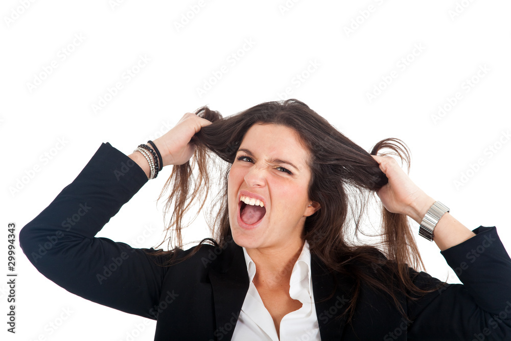 Businesswoman going crazy pulling her hair in frustration Businesswoman going crazy pulling her hair in frustration