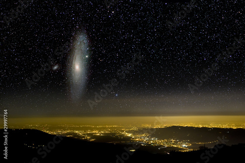 The Universe above city lights. The Andromeda galaxy.