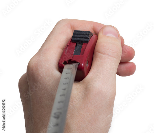 a tape measure on a hand . photo