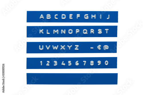 Embossed alphabet on blue plastic tape