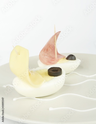 egg boats sailing on a plate
