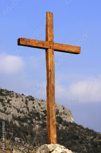 solitary cross on hilltop