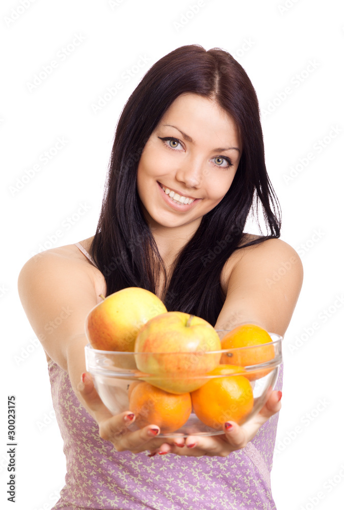 Happy woman holding a dish with fruits on white background Happy woman holding a dish with fruits on white background