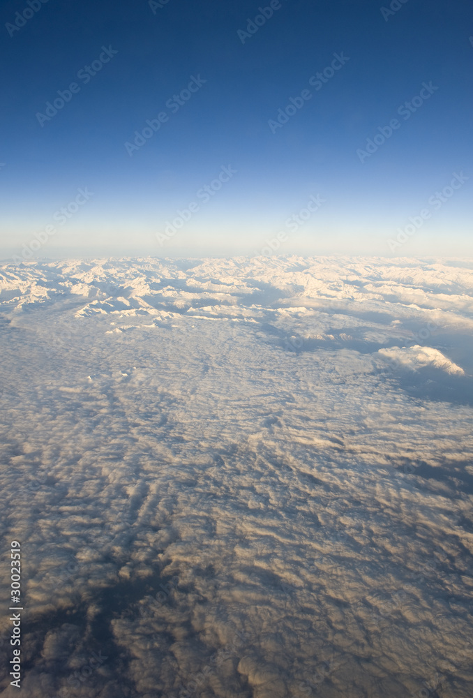 High altitude view of the Dolomites and cloud layer High altitude view of the Dolomites and cloud layer
