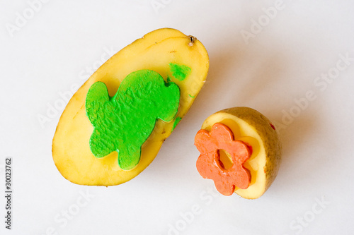 Handmade potato stamps for children with rabbit and flower