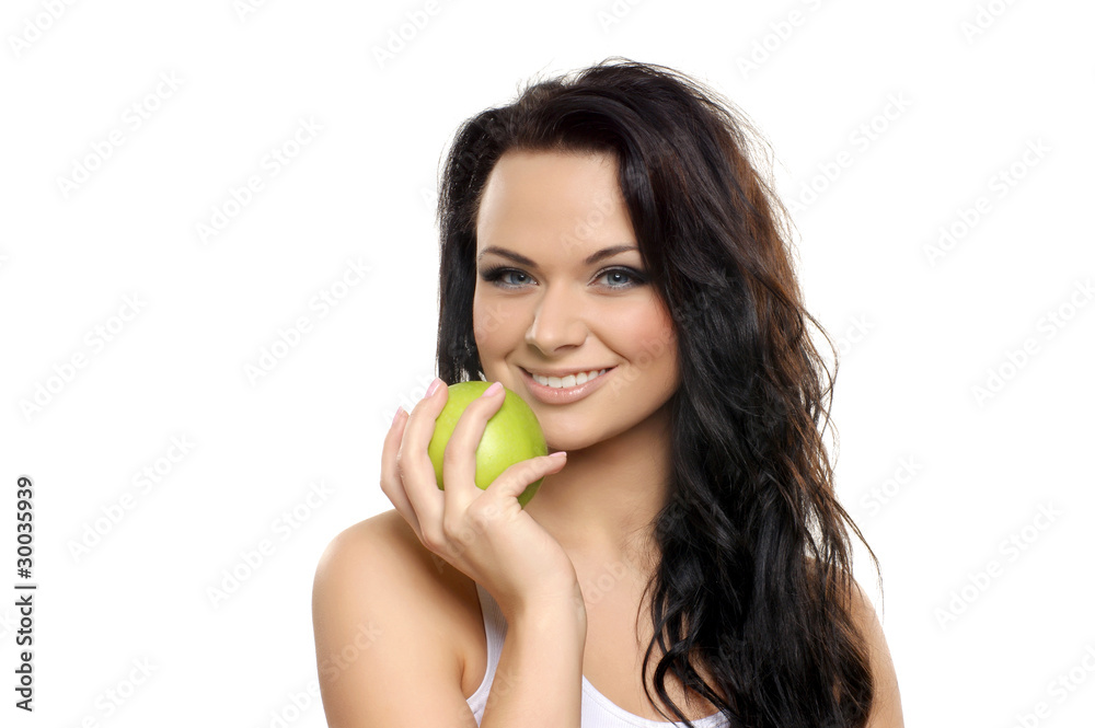 Portrait of a young brunette holding a fresh green apple Portrait of a young brunette holding a fresh green apple