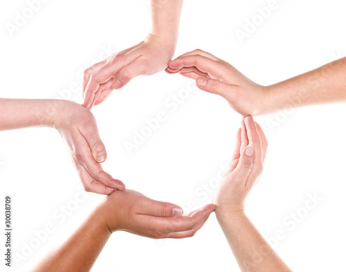 Group of hands forming a circle