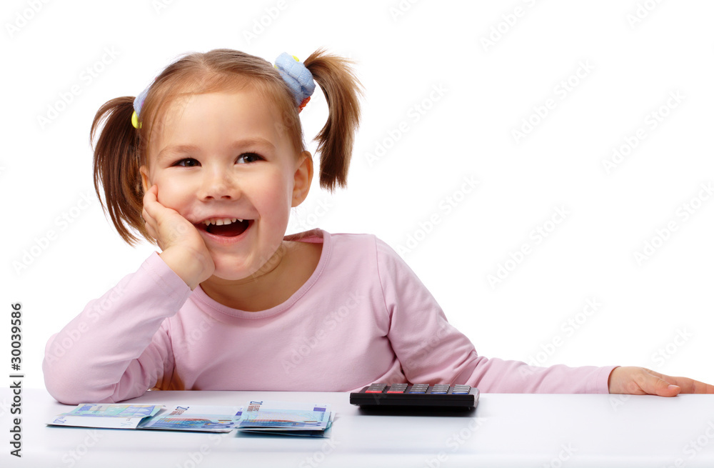 Little girl with few paper euro banknotes Little girl with few paper euro banknotes