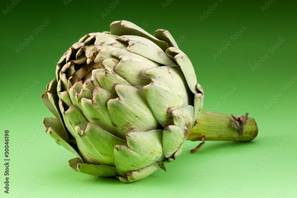 Fototapeta premium Artichoke on a green background