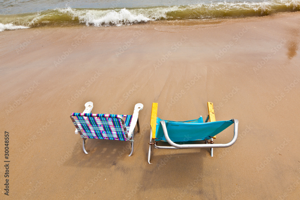 beach with two chairs for relaxing