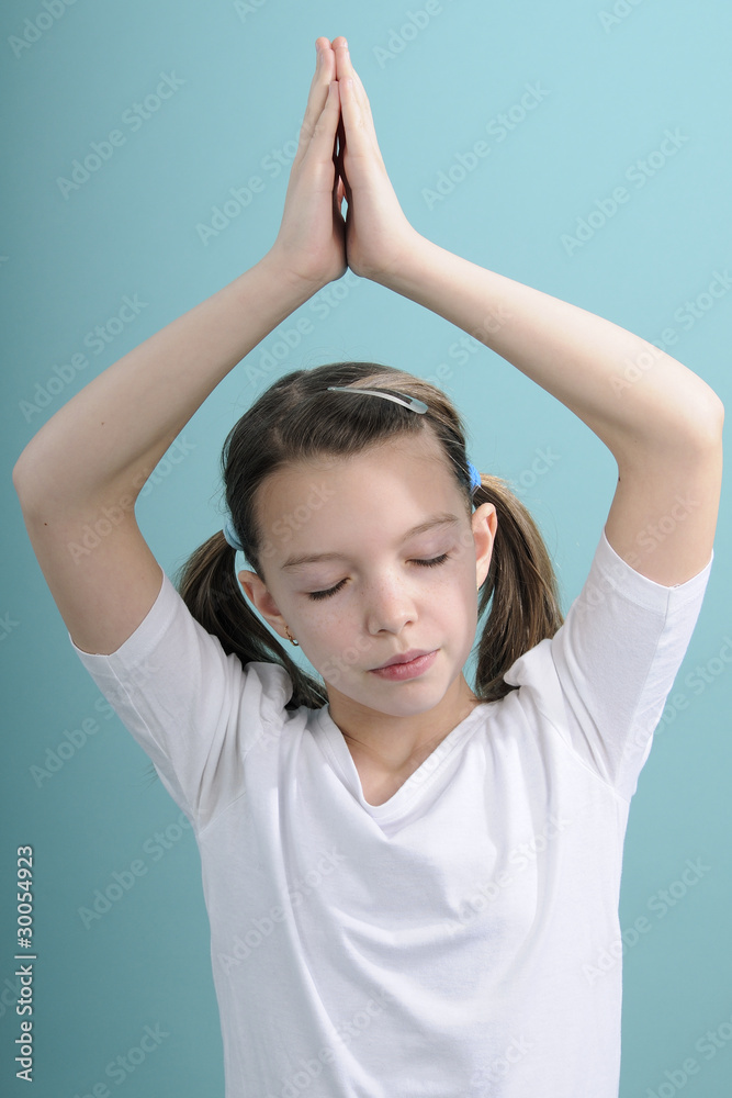 girl concentrating for yoga exercises girl concentrating for yoga exercises
