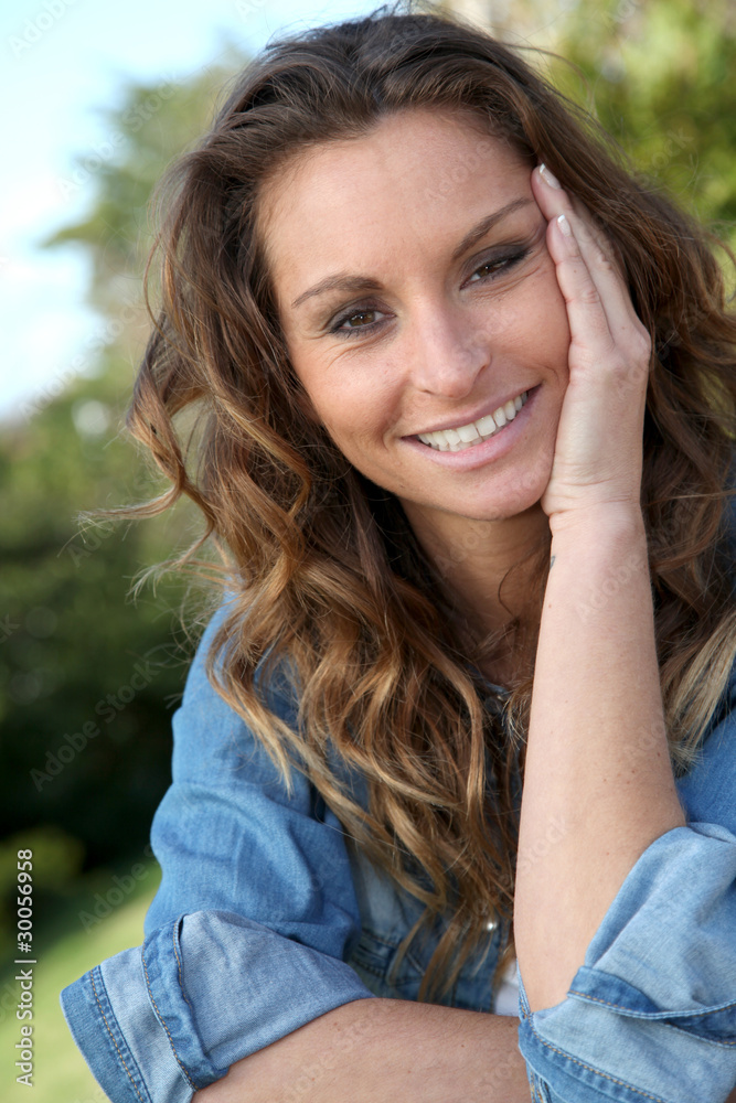 Portrait of beautiful woman relaxing in home garden Portrait of beautiful woman relaxing in home garden