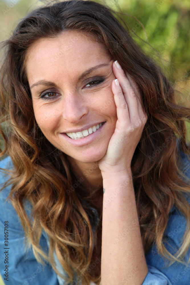 Portrait of beautiful woman relaxing in home garden Portrait of beautiful woman relaxing in home garden