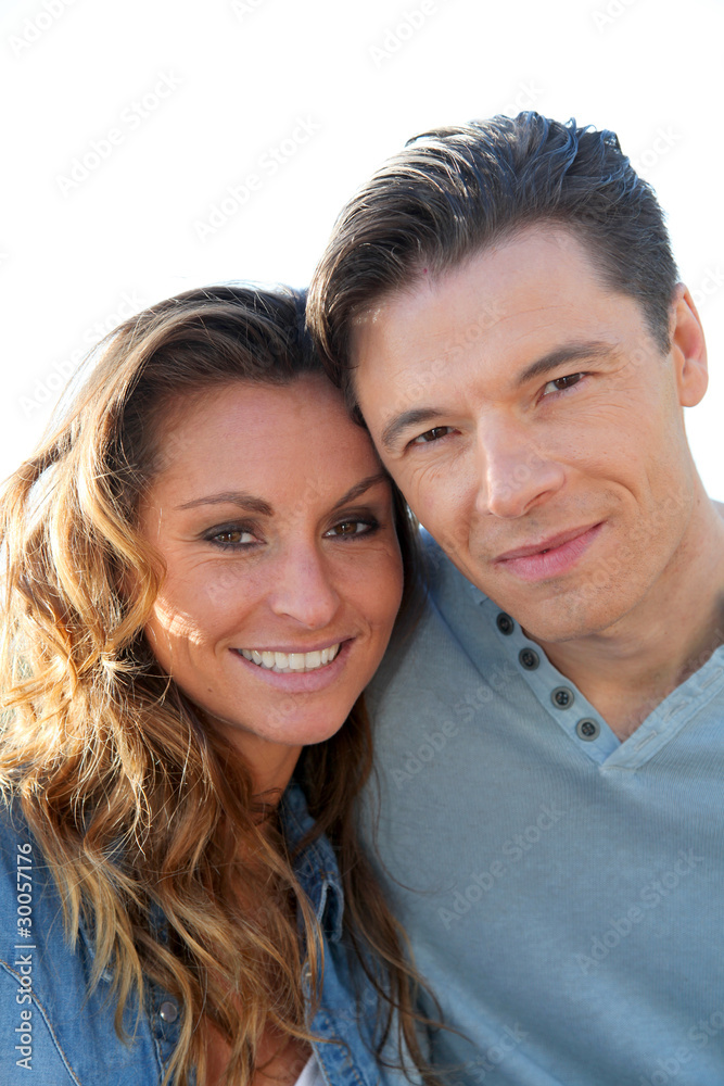 happy couple standing outside on a sunny day happy couple standing outside on a sunny day